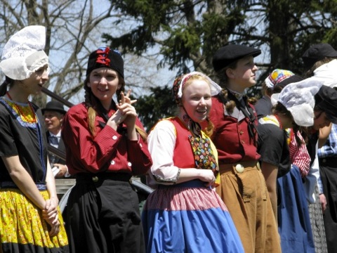 line of clog dancers in traditional dutch costumes
