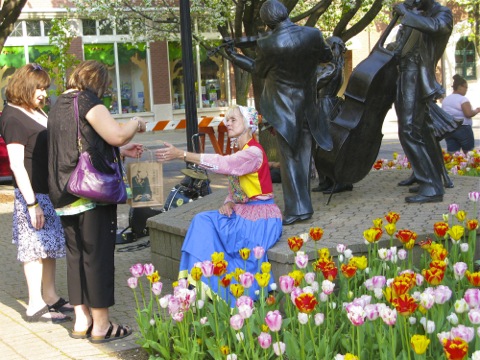 Tulips and a Dutch costumed girl in downtown Holland, Michigan