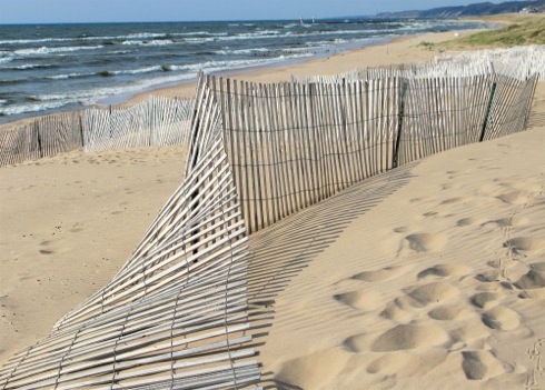 waves and snow fence on beach - Saugatuck, Michigan