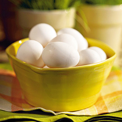 white eggs in a yellow bowl