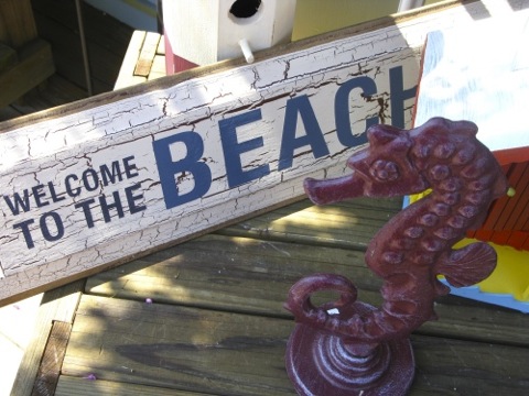 Welcome to the Beach sign with a seahorse sculpture - South Haven, MI