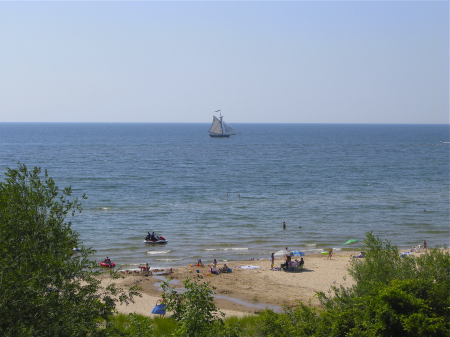 The sloop Friends Good Will sailing off the beach at South Haven, MI