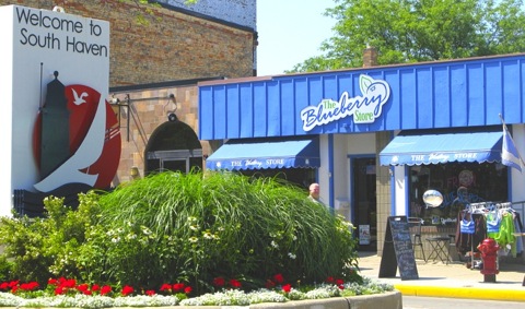 Exterior of The Blueberry Store and the Welcome to South Haven sign on Phoenix Street.