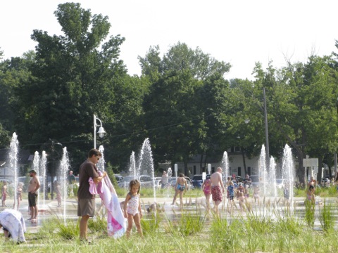 People playing in the Whirlpool Compass Fountain in St. Joseph, Michigan