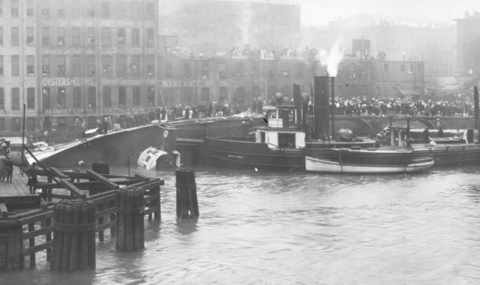 The SS Eastland lying on its side in the Chicago River after capsizing - 1915
