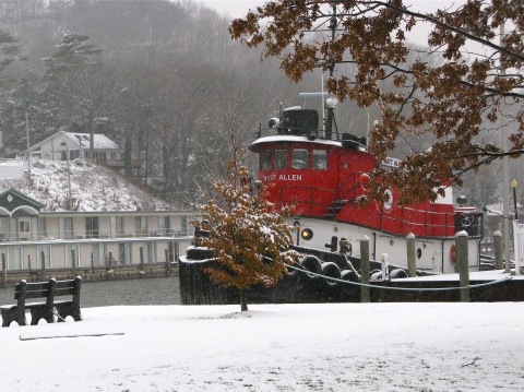 Tugboat Matt Allen tied up in winter on the Kalamazoo River in Saugatuck, MI