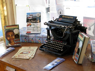 Typewriter on desk with books