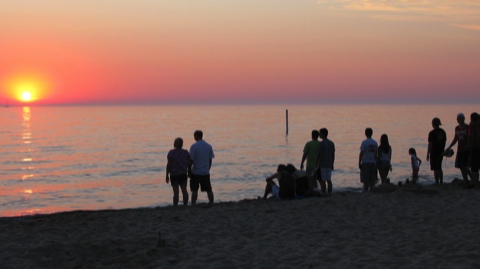 Sunset watchers on the beach in Saugatuck, Michigan