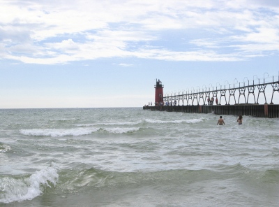 Pier with lighthouse and swimmers - South Haven, Michigan