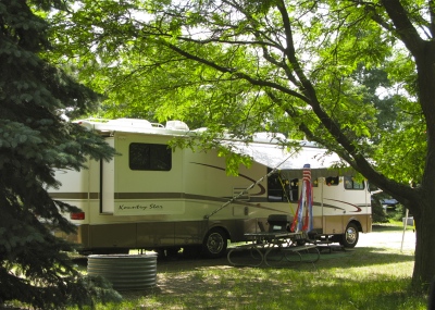 RV in forest campsite