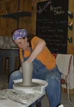 Dawn Soltysiak on the pottery wheel at Khnemu Studio on Fernwood Farm - Fennville, Michigan
