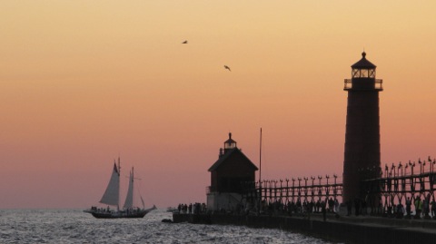 Sunset with sailboat and the light houses at Grand Haven, Michigan