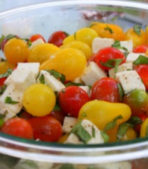 A glass bowl of Caprese Salad